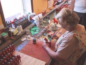 Artist painting Dala horse