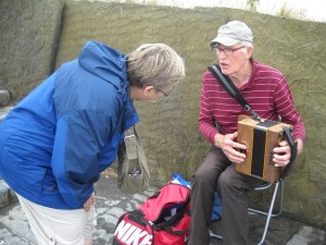 Local musician at Cliffs of Moher, Ireland