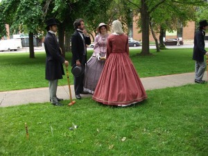 Delegates (actors) playing croquet